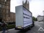A mobile billboard for the Take Back Parliament movement drives past the Houses of Parliament with the words 'No more stolen elections. Fair votes now!'. Take Back Parliament brings together a coalition of different groups and organisations in the call for fair votes. They include POWER2010, Unlock Democracy. Electoral Reform Society and Vote for a Change.